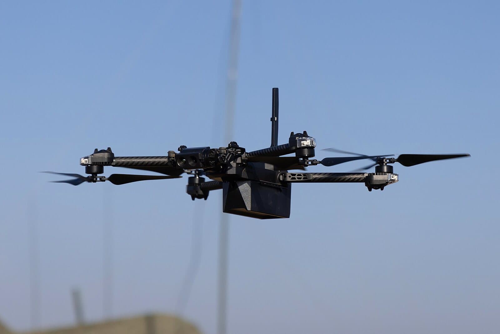 Quadcopter reconnaissance drone in flight